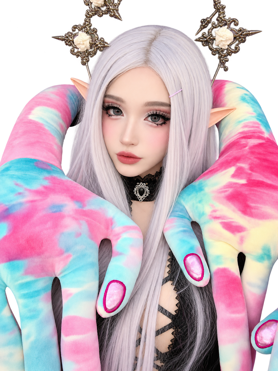 Silver-haired elf cosplayer with pointed ears, ornate rose headpieces, and a black gothic outfit, framed by oversized pastel pink and turquoise tentacle-like plush arms.