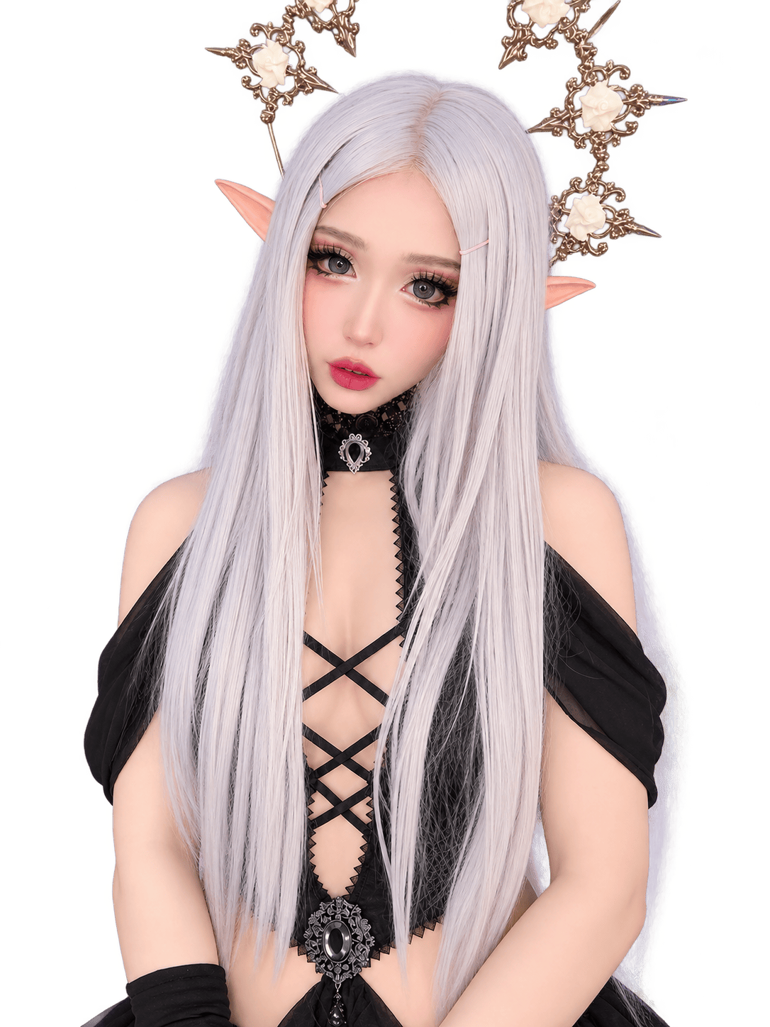 Silver-haired elf cosplayer with pointed ears, an ornate gold-toned crown decorated with ivory roses, a black lace-up gothic outfit, and a jeweled choker.